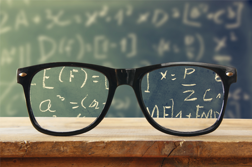 Glasses reading a chalkboard