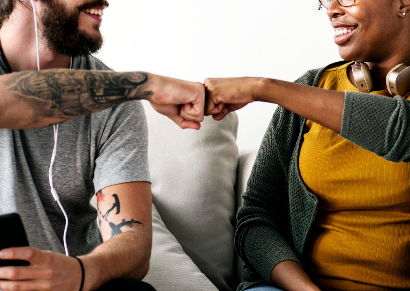 musician-couple-fist-bumping-UDXS582-scaled