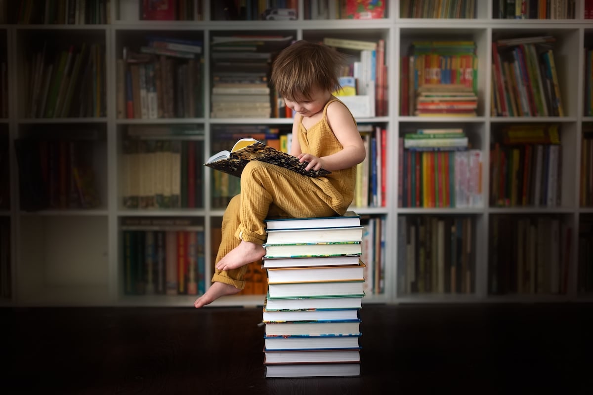 child-reading-book-at-home-2022-03-06-04-19-43-utc